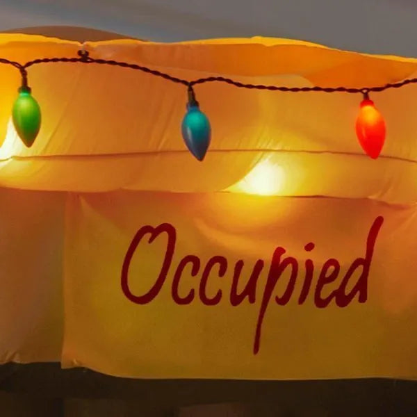 animated inflatable santa coming out of the house