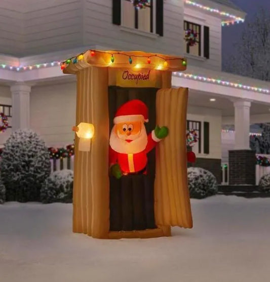 Christmas-animated inflatable santa coming out of the house