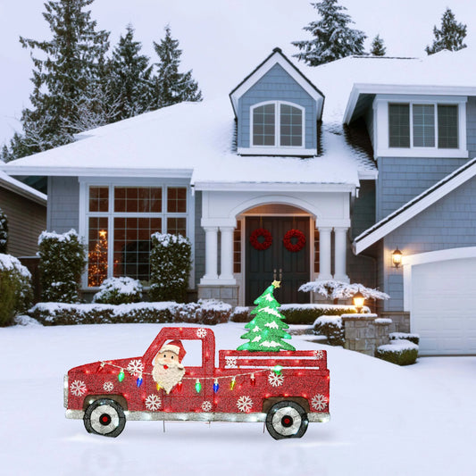 Santa Claus driving a bright red truck